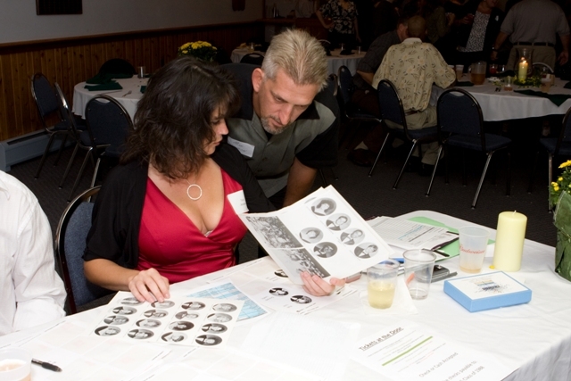 Mike is making sure Toni gets the nametags right!